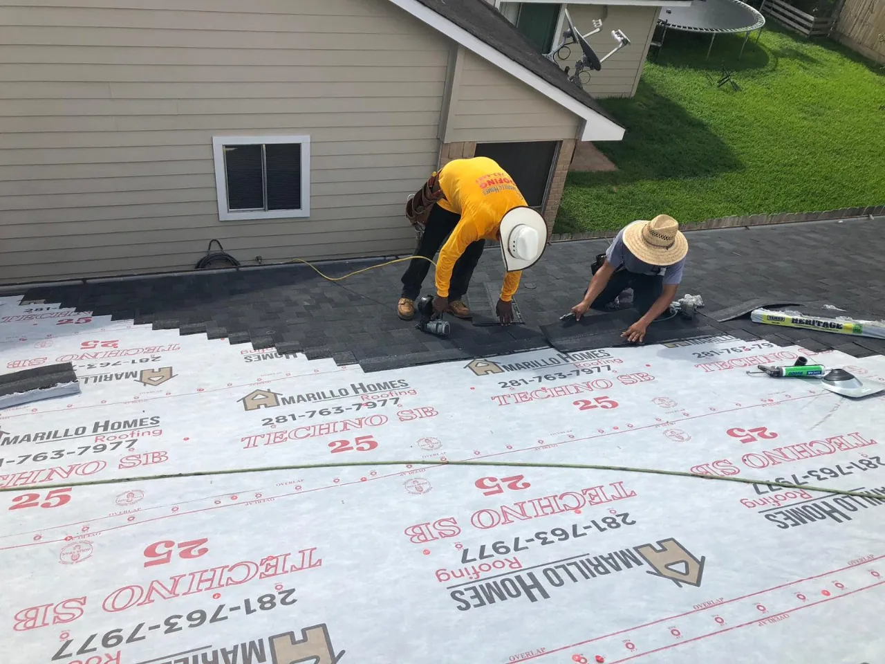 Amarillo Homes Roofing crew installing shingles over branded synthetic underlayment on a Katy, Texas home